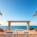 Genieße den Blick auf die elegante coastal cabana inmitten von Palmen mit Blick auf das Meer.