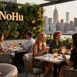 Enjoying a sunset cocktail at NoHu Rooftop, showcasing a vibrant nightlife atmosphere.